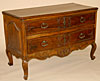 French, 18th century, carved sauteuse (two-drawer Provenal commode)